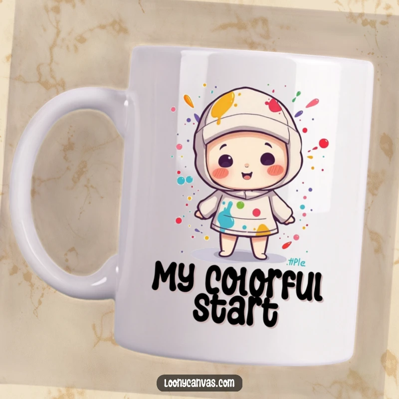 Funny kawaii canvas character playfully splattered with colorful paint, printed on a mug, celebrating artistic messiness.
