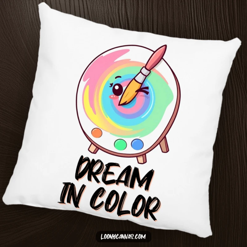 Funny kawaii winking paintbrush creating a colorful swirl on a comfortable pillow, perfect for adding humor and art.