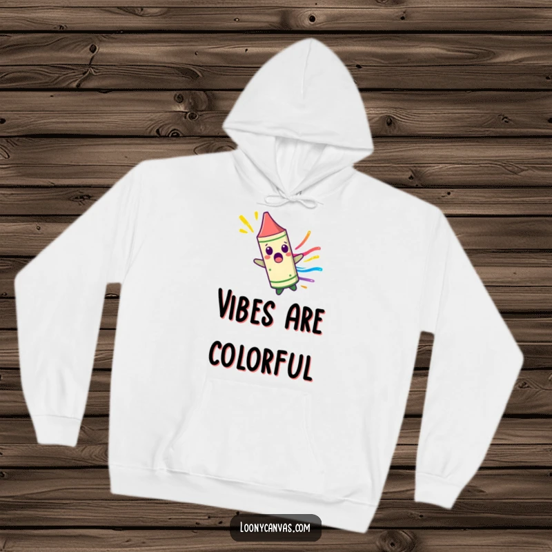 Funny surprised crayon character spinning uncontrollably, leaving a colorful streak on a cozy hoodie, perfect for vibrant and comfortable wear.