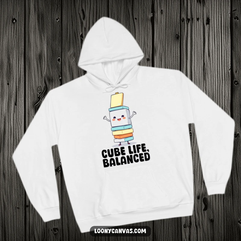 Funny hoodie depicting a cheerful cube character enthusiastically balancing a stack of wobbling canvases, ideal for cozy artistic sessions.
