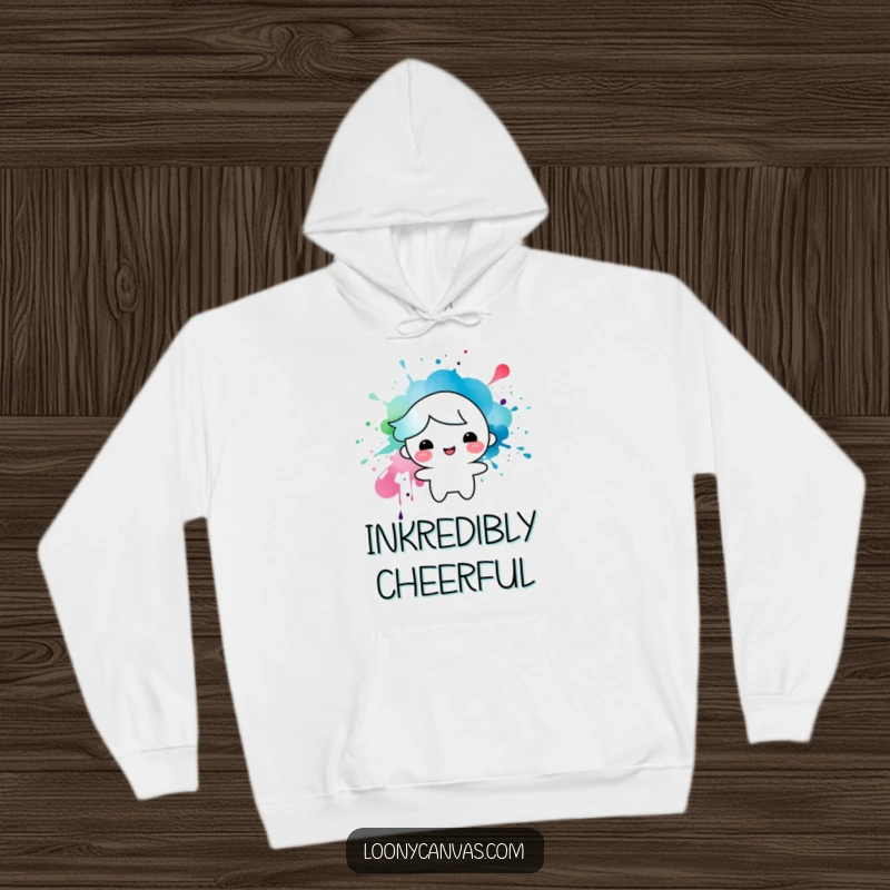 Funny hoodie showcasing a happy character formed from a vibrant ink splatter, a cozy and artistic addition to any wardrobe.
