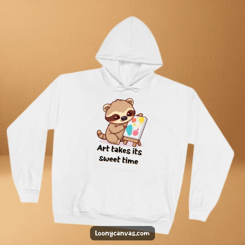 Funny hoodie depicting a playful sloth character slowly applying paint to a tiny canvas, a humorous and cozy design.