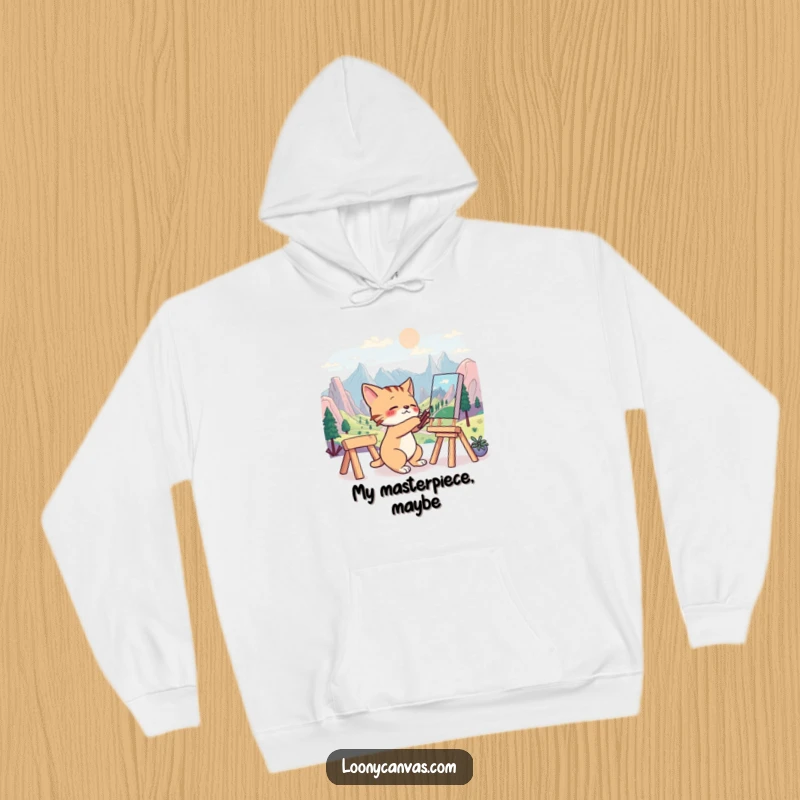 Funny hoodie featuring a frantic cat artist intensely focused on painting a surreal landscape, radiating creative energy.