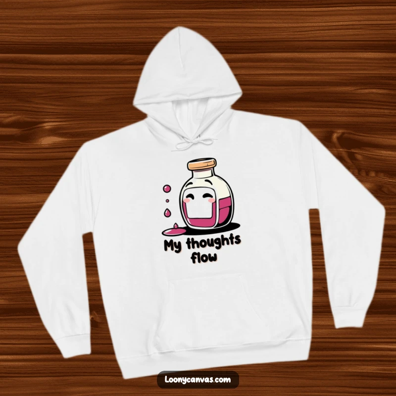 Funny giggling ink bottle character spilling tiny drops of ink with a mischievous wink on a cozy hoodie, perfect for creative comfort.