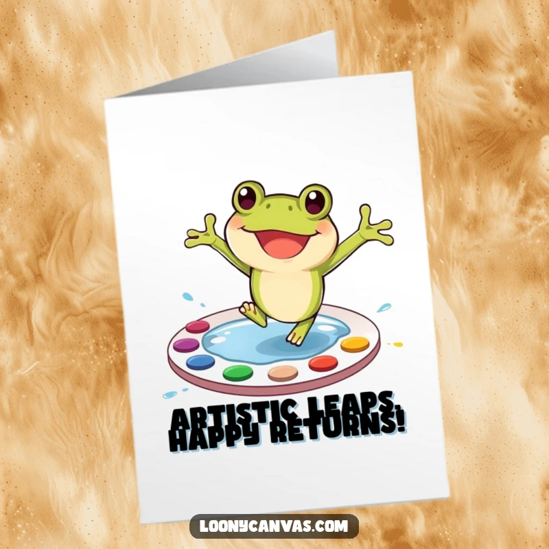 Funny Free Printable Birthday Card: A happy frog leaps into a paint palette, creating colorful art, a joyful downloadable gift.