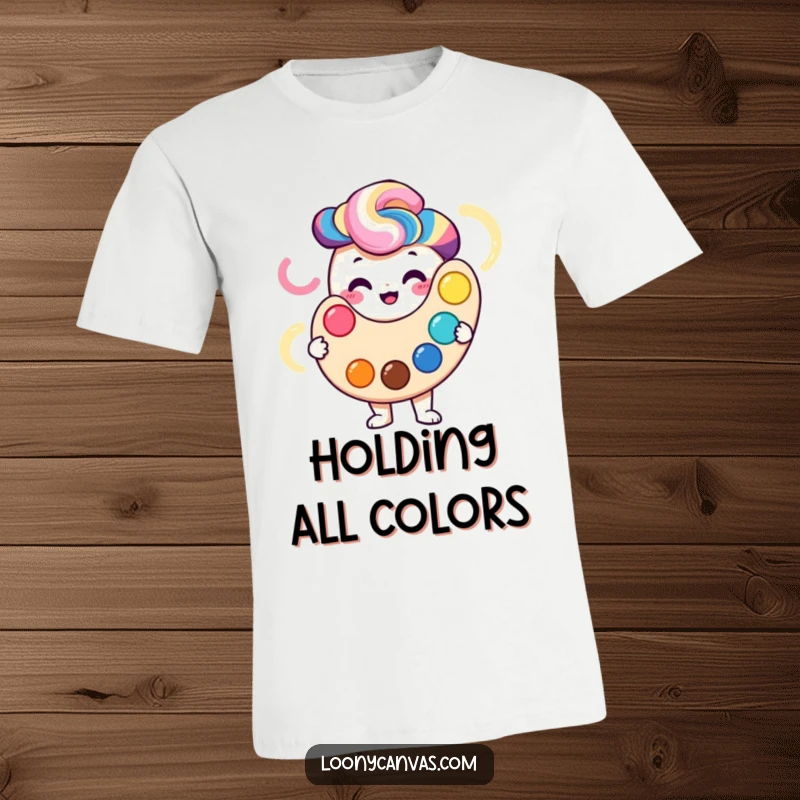 Smiling palette character holding a vibrant, swirling spectrum of colors, featured on a t-shirt.