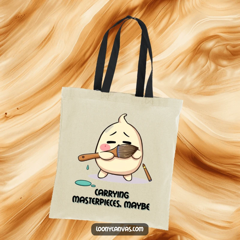 Funny tote bag showcasing a bewildered blob character comically wrestling with a giant paintbrush, a humorous accessory for art enthusiasts.