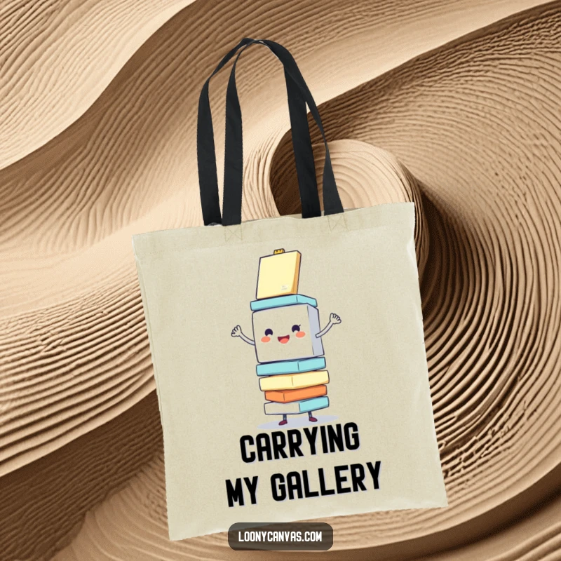 Funny tote bag featuring a cheerful cube character enthusiastically balancing a stack of wobbling canvases, perfect for transporting art supplies with humor.