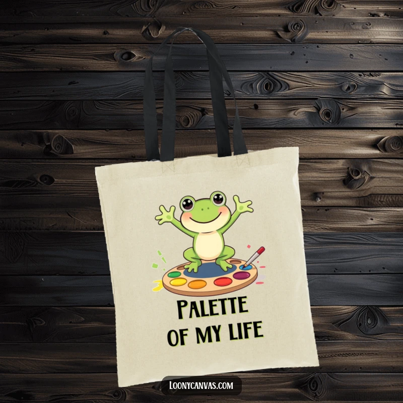 Funny joyful frog character jumping into a paint palette, this tote bag is a functional and funny gift.