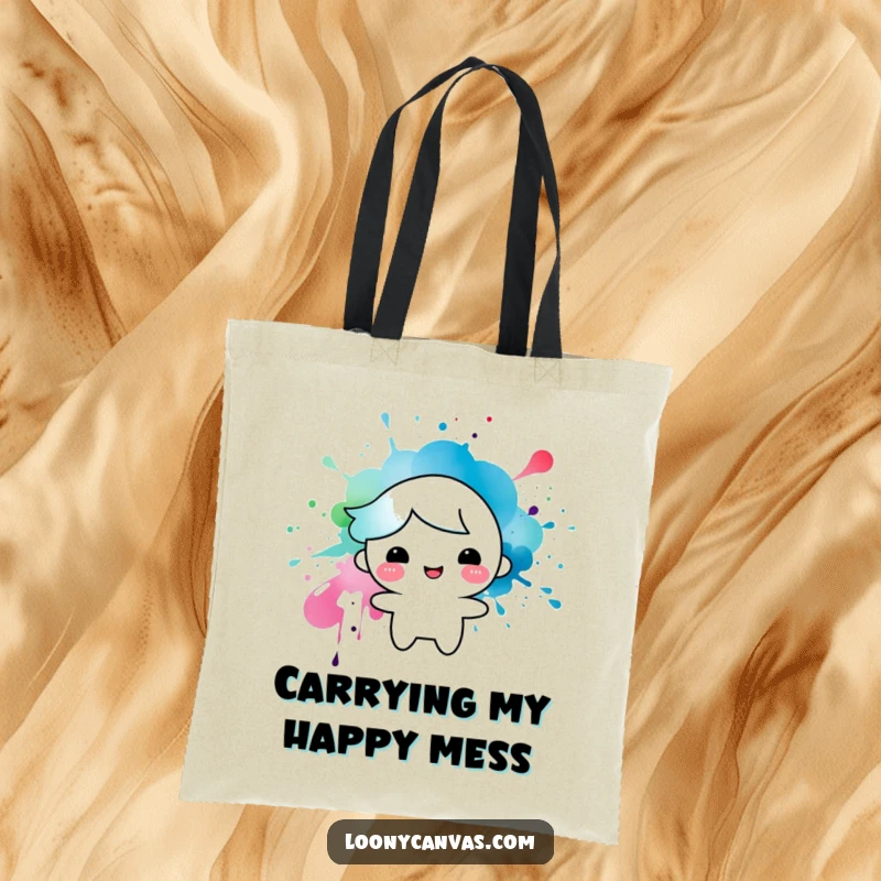 Funny tote bag with a happy character formed from an ink splatter, a humorous and practical accessory for art lovers.