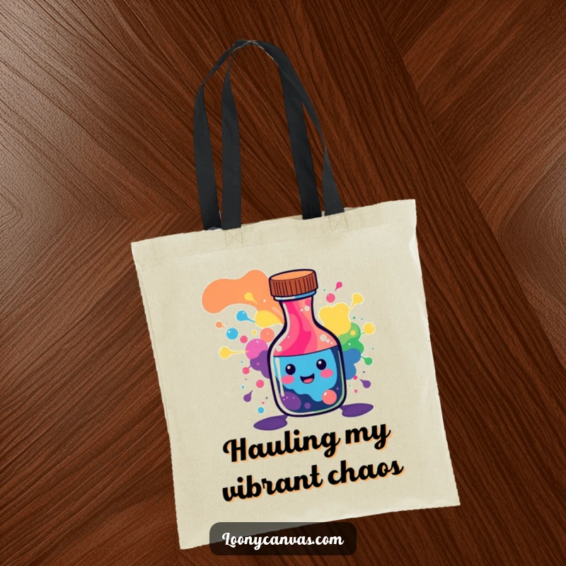 Funny tote bag with a cheerful ink bottle character spilling a vibrant, abstract rainbow of patterns.